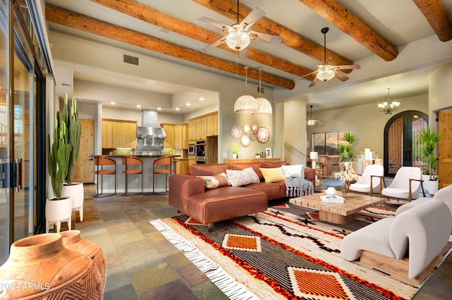 35824 N Tom Darlington Dr, Carefree, AZ 85377 - living room featuring a ceiling fan, a chandelier, stone tile floors, and beam ceiling