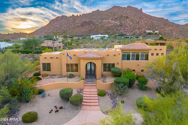 35824 N Tom Darlington Dr, Carefree, AZ 85377 - pueblo-style home with a tile roof, stucco siding, a mountain view, and french doors