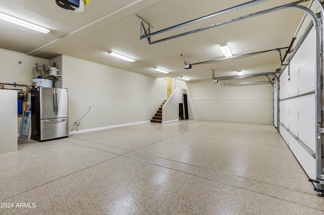35824 N Tom Darlington Dr, Carefree, AZ 85377 - garage featuring freestanding refrigerator and a garage door opener