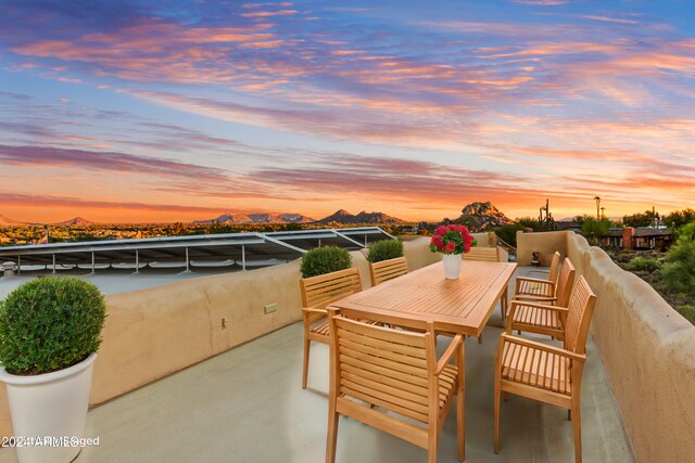 35824 N Tom Darlington Dr, Carefree, AZ 85377 - patio terrace at dusk with a mountain view and a balcony