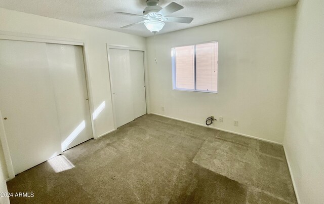 hallway featuring light colored carpet