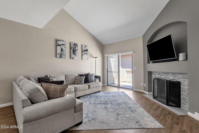 living room with vaulted ceiling and hardwood / wood-style floors