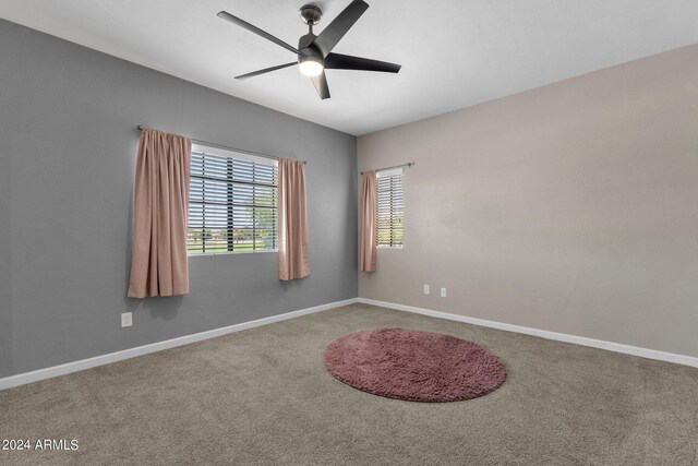 unfurnished room featuring carpet floors and ceiling fan