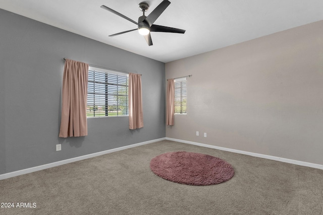 unfurnished room featuring ceiling fan, baseboards, and carpet flooring