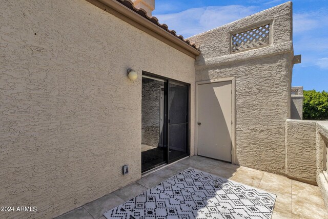 property entrance with a patio