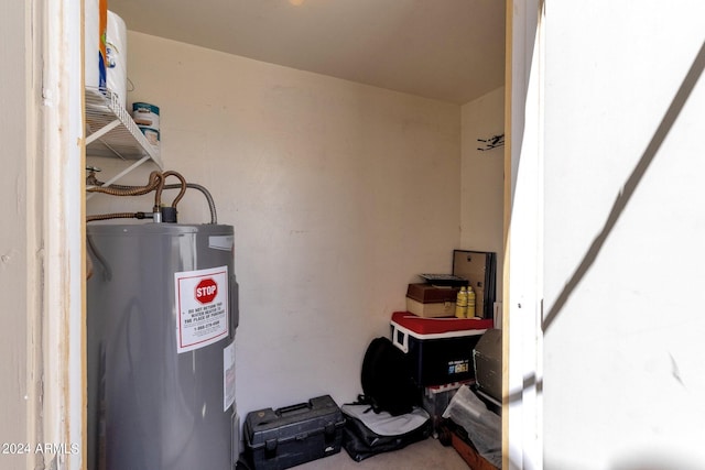 utility room featuring electric water heater