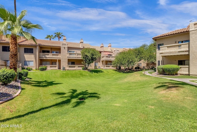 view of home's community featuring a lawn