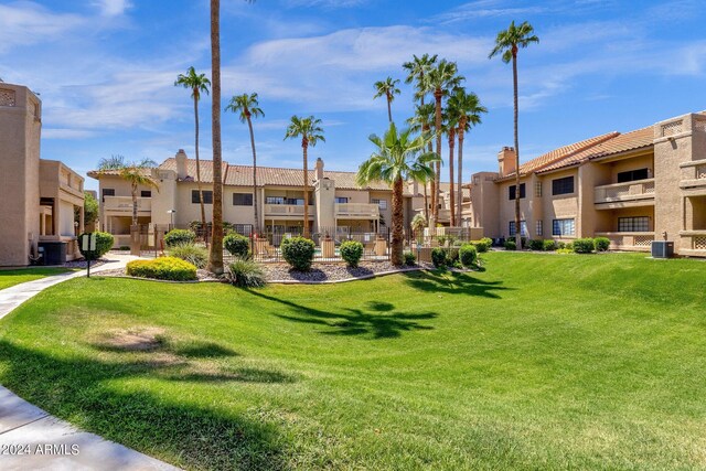 view of property's community with a lawn