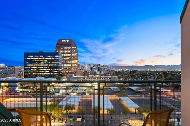 balcony at dusk with a city view