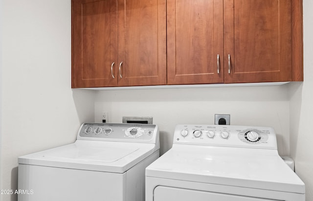 clothes washing area with cabinet space and separate washer and dryer