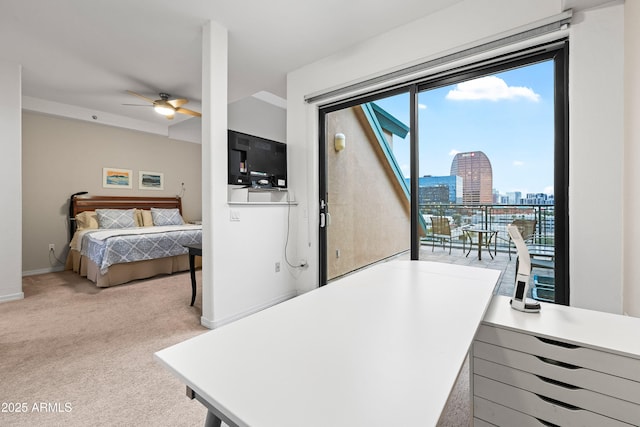 carpeted bedroom with access to outside and baseboards