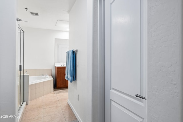 bathroom featuring a garden tub, visible vents, vanity, a shower stall, and tile patterned flooring