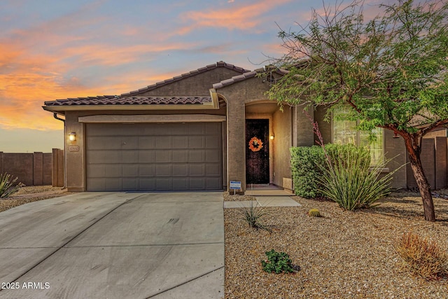 17532 W Copper Ridge Dr, Goodyear, AZ 85338 - view of front of house with a garage, fence, stucco siding, driveway, and a tile roof