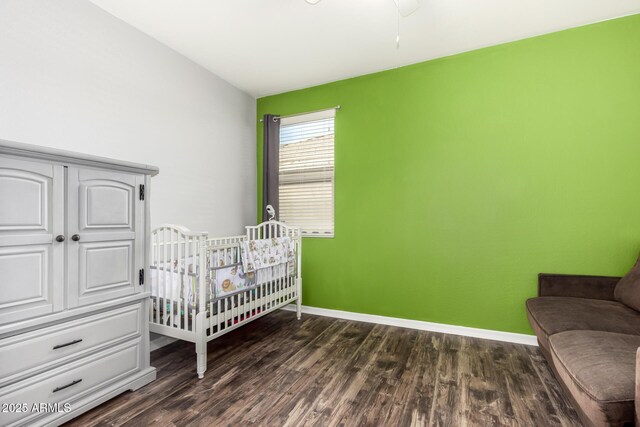 17532 W Copper Ridge Dr, Goodyear, AZ 85338 - bedroom with dark wood-type flooring and baseboards