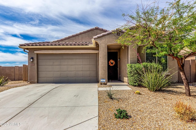 17532 W Copper Ridge Dr, Goodyear, AZ 85338 - view of front of property featuring fence, an attached garage, stucco siding, a tiled roof, and driveway