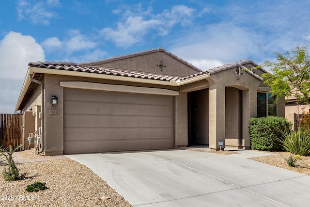 17532 W Copper Ridge Dr, Goodyear, AZ 85338 - view of front of home with concrete driveway, stucco siding, a tile roof, and a garage