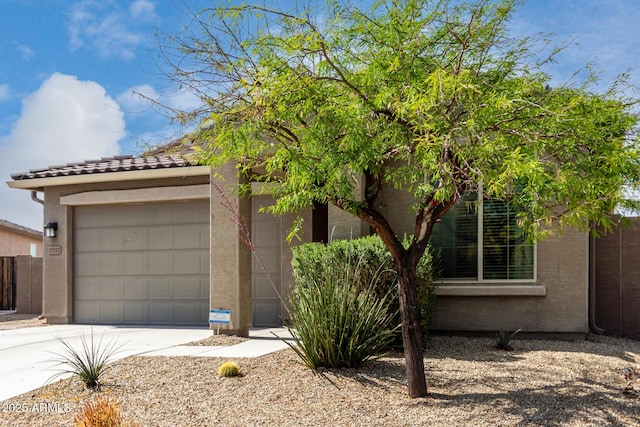17532 W Copper Ridge Dr, Goodyear, AZ 85338 - view of front of house featuring an attached garage, stucco siding, a tiled roof, and concrete driveway