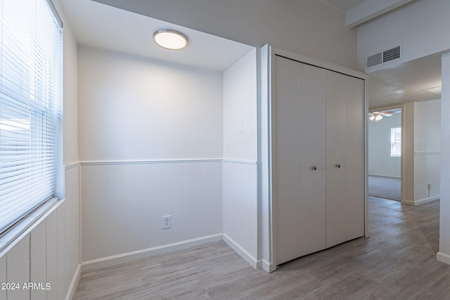 corridor featuring light hardwood / wood-style floors