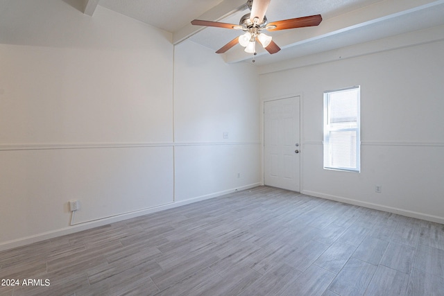 empty room with light wood-style floors, ceiling fan, and baseboards