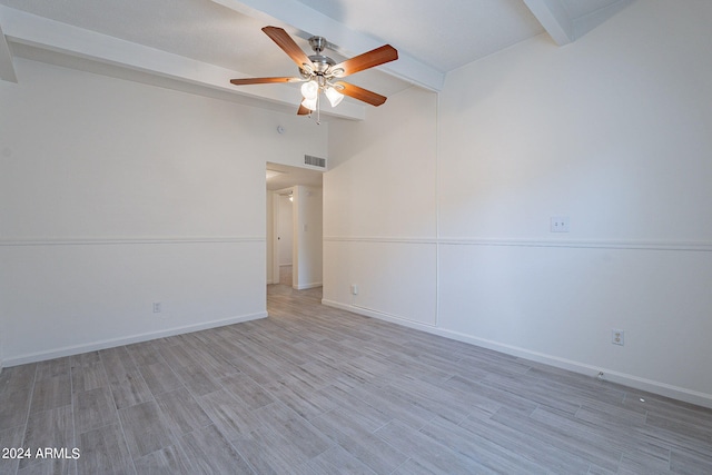 unfurnished room with light wood-type flooring, ceiling fan, and vaulted ceiling with beams