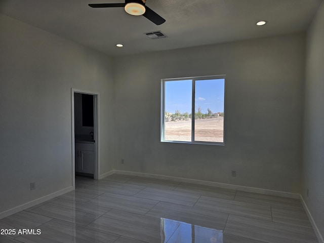unfurnished room featuring baseboards, ceiling fan, recessed lighting, and visible vents
