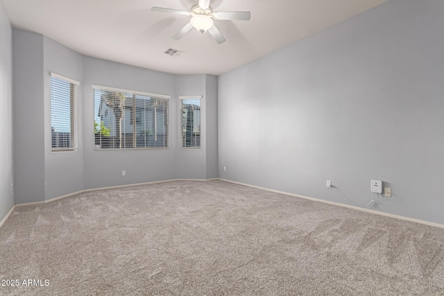 carpeted empty room with ceiling fan