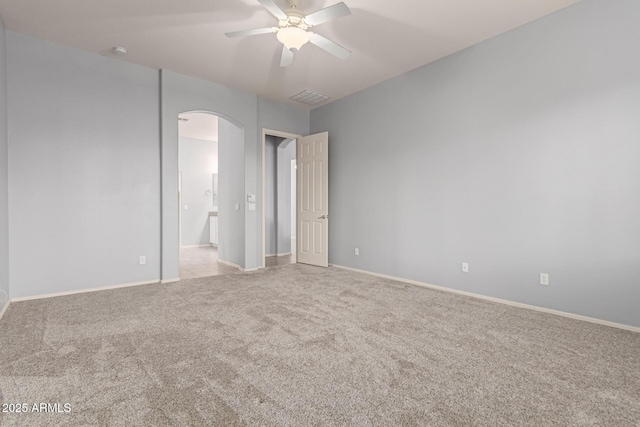 unfurnished bedroom featuring ceiling fan and light carpet