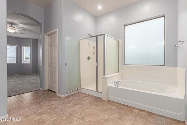 bathroom featuring tile patterned floors, ceiling fan, and independent shower and bath