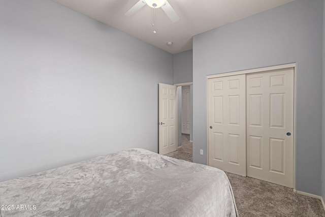 carpeted bedroom with a closet and ceiling fan