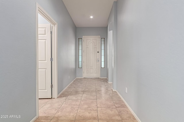 corridor with light tile patterned flooring