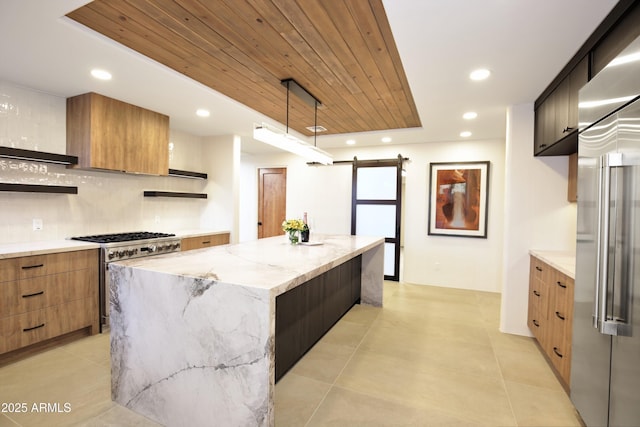 1637 N Quartz Valley Rd, Scottsdale, AZ 85266 - kitchen with open shelves, premium appliances, modern cabinets, a kitchen island, and light stone counters