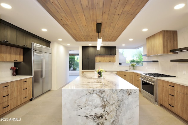 1637 N Quartz Valley Rd, Scottsdale, AZ 85266 - kitchen with high quality appliances, modern cabinets, backsplash, wooden ceiling, and light stone counters