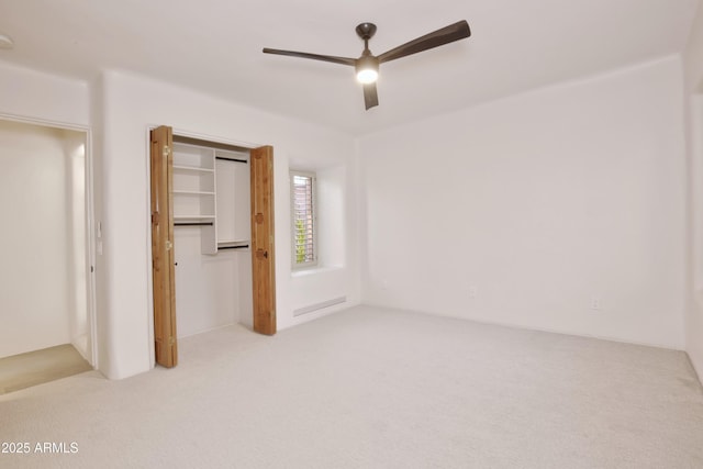 1637 N Quartz Valley Rd, Scottsdale, AZ 85266 - unfurnished bedroom featuring light carpet, a closet, and a ceiling fan