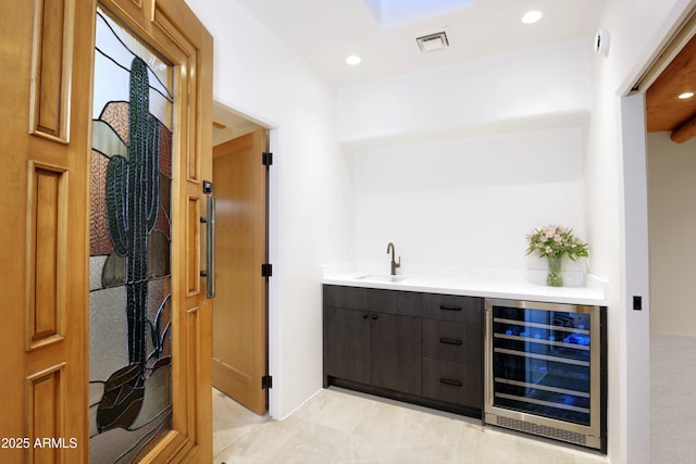 1637 N Quartz Valley Rd, Scottsdale, AZ 85266 - indoor wet bar featuring beverage cooler, light tile patterned floors, and recessed lighting