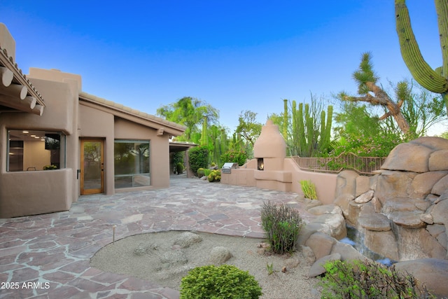 1637 N Quartz Valley Rd, Scottsdale, AZ 85266 - view of patio / terrace featuring a fireplace