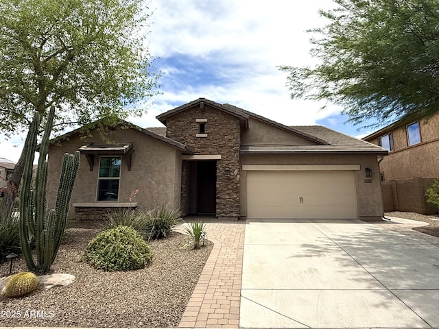 3721 W Aracely Dr, New River, AZ 85087 - view of front facade featuring stucco siding, an attached garage, driveway, and stone siding