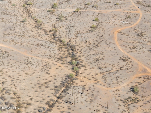 birds eye view of property featuring view of desert