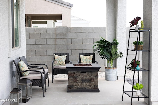 view of patio with a fire pit