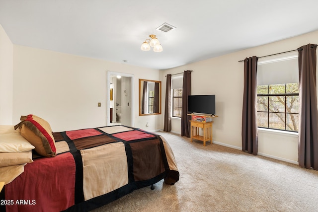 carpeted bedroom with baseboards and visible vents
