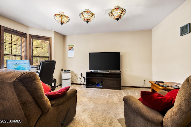 living room featuring carpet floors and baseboards