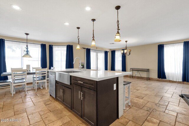 508 W San Angelo St, Gilbert, AZ 85233 - kitchen with a sink, stone tile flooring, stainless steel dishwasher, dark brown cabinetry, and recessed lighting