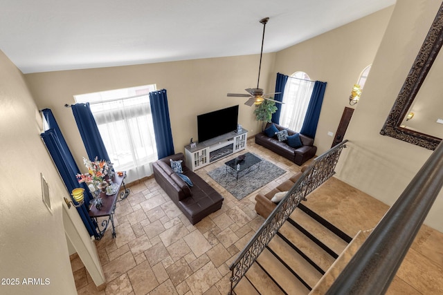 508 W San Angelo St, Gilbert, AZ 85233 - living area with stone tile floors, ceiling fan, and high vaulted ceiling