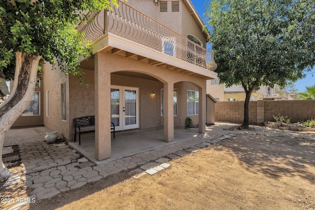 508 W San Angelo St, Gilbert, AZ 85233 - rear view of property with french doors, stucco siding, a balcony, and a patio