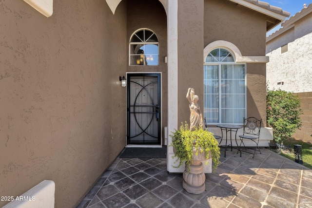508 W San Angelo St, Gilbert, AZ 85233 - doorway to property with stucco siding and a patio area