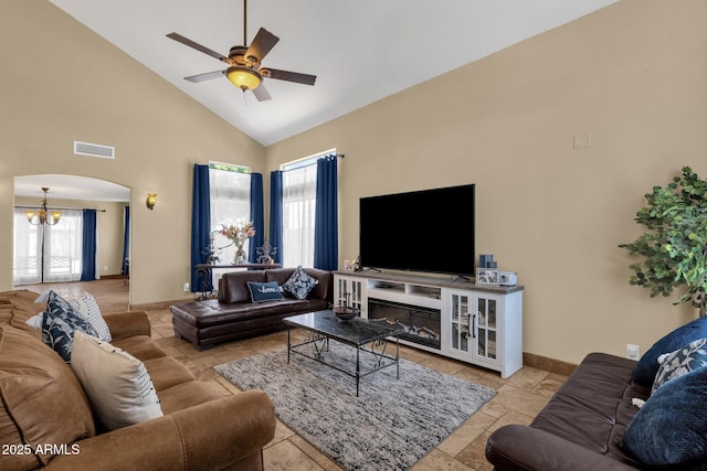 508 W San Angelo St, Gilbert, AZ 85233 - living room featuring high vaulted ceiling, a ceiling fan, a chandelier, arched walkways, and baseboards