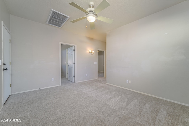 unfurnished bedroom featuring a ceiling fan, baseboards, visible vents, and carpet flooring