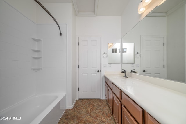 full bath featuring washtub / shower combination, stone finish flooring, and vanity