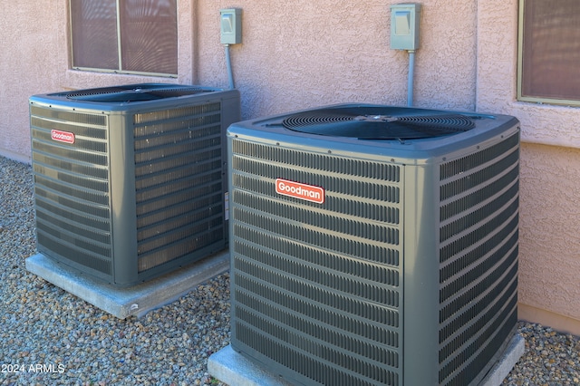 exterior details with stucco siding and central air condition unit