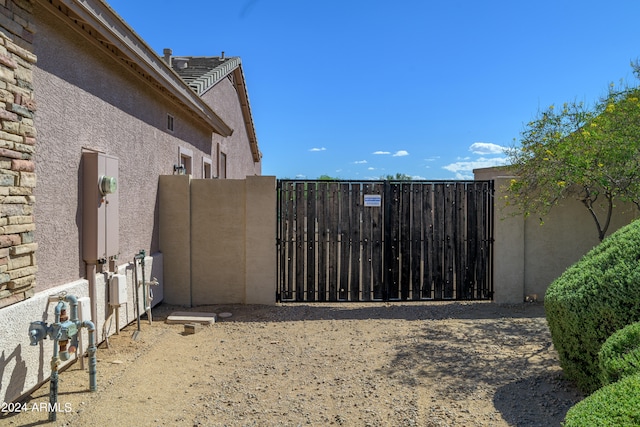 view of gate featuring fence