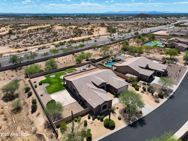 birds eye view of property with view of desert